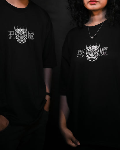 Suggestion
Two people wearing black t-shirts with a white logo and text on a dark background